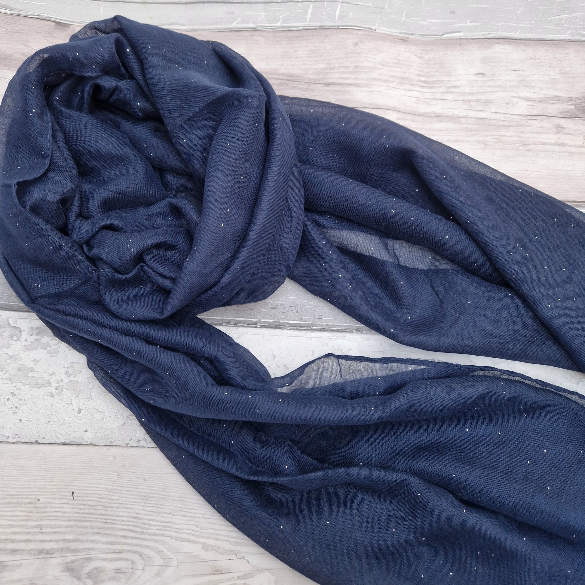 Navy scarf with a silver glitter finish.