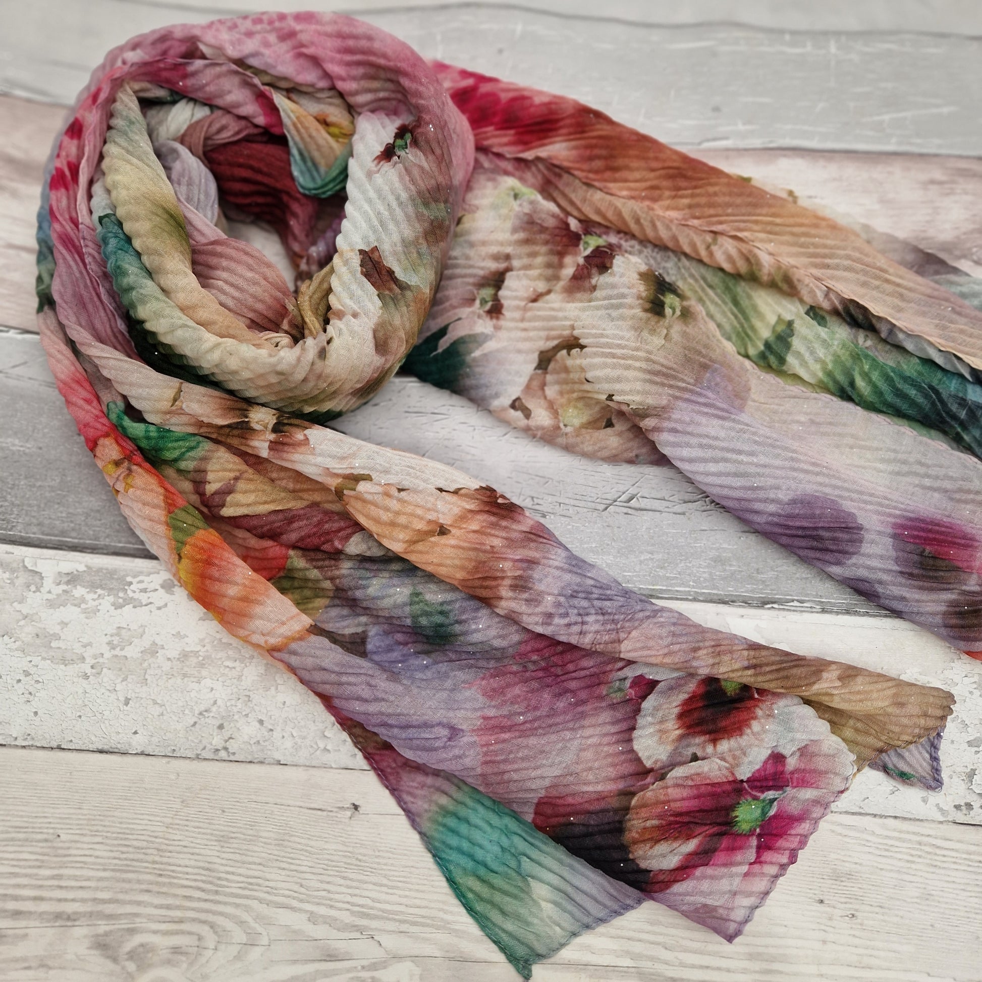 Crinkle scarf covered in a bouquet of beautiful flowers.