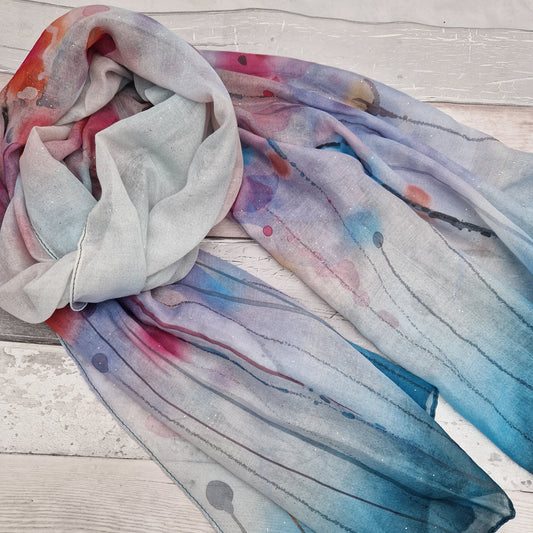 Watercolour scarf with a poppy print in red, pinks and teal blue.