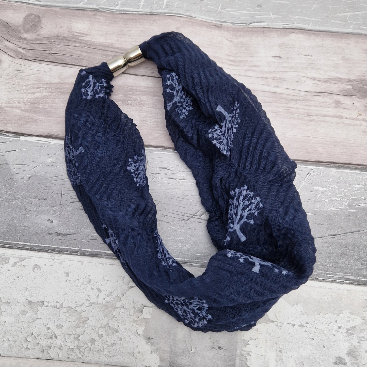 Navy neck scarf with tree of life print.