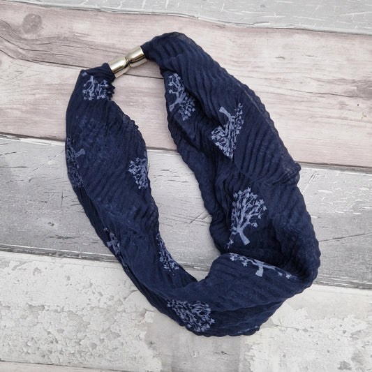 Navy neck scarf with tree of life print.