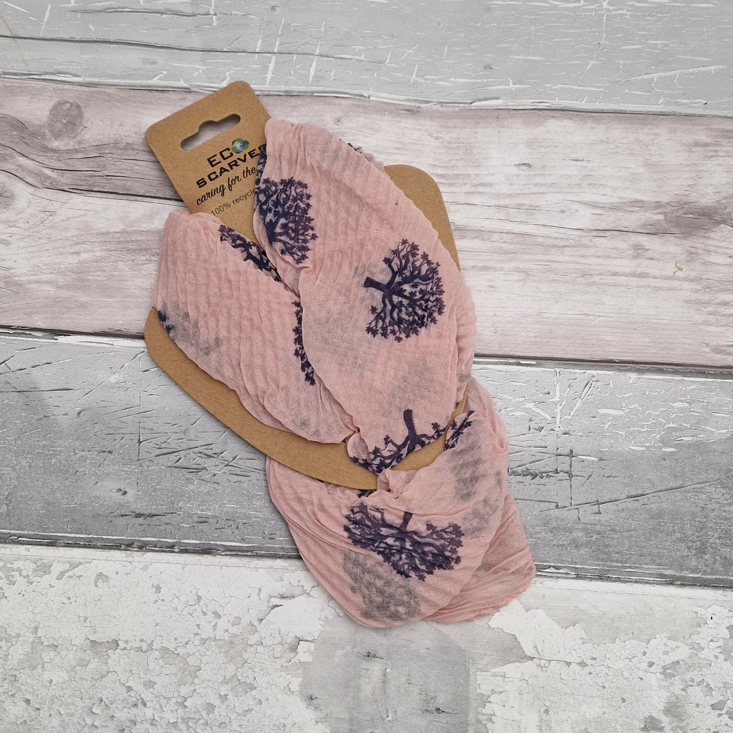 Pink neck scarf with a navy tree of life print.