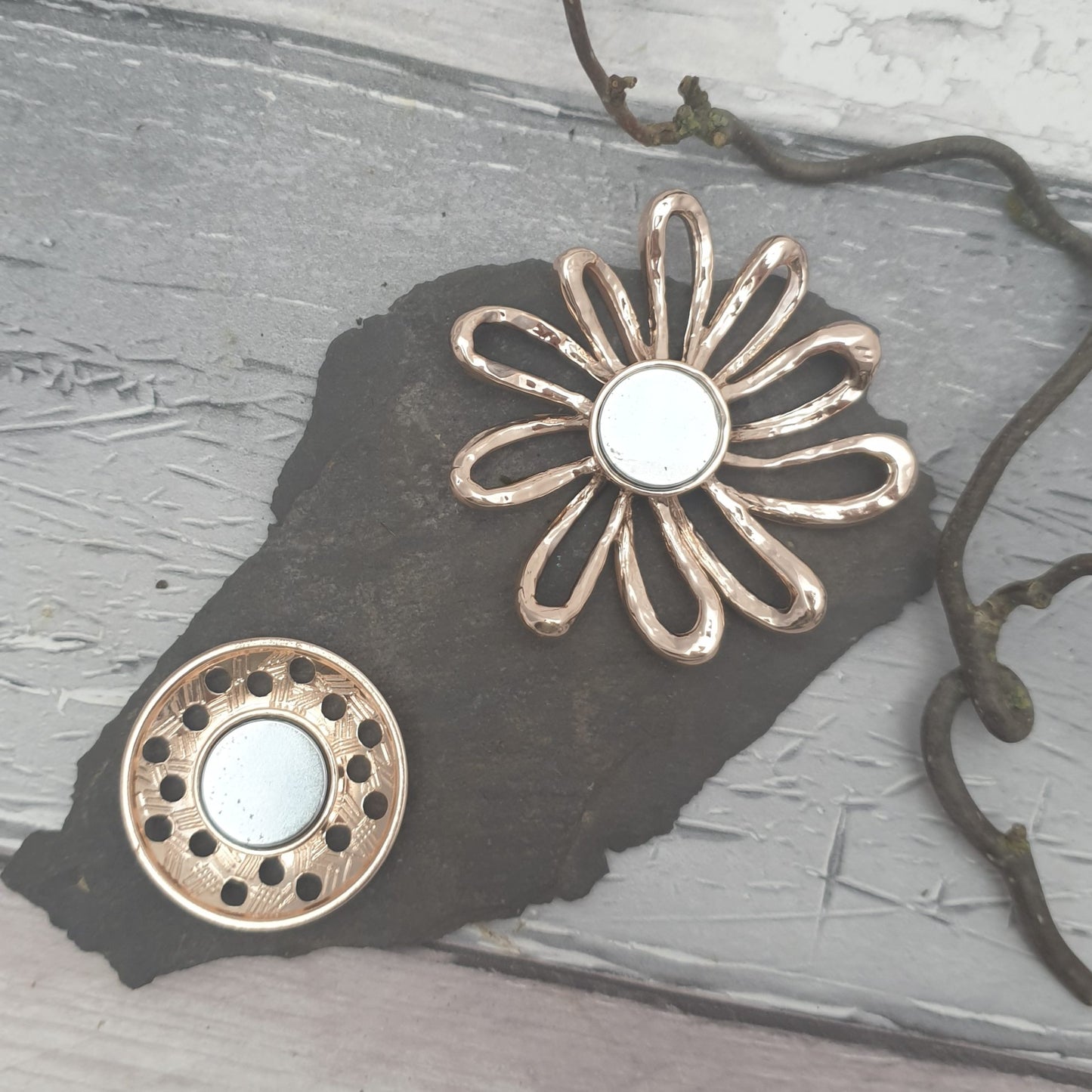 Rear of magnetic flower shaped brooch showing the 2 pieces and their magnets
