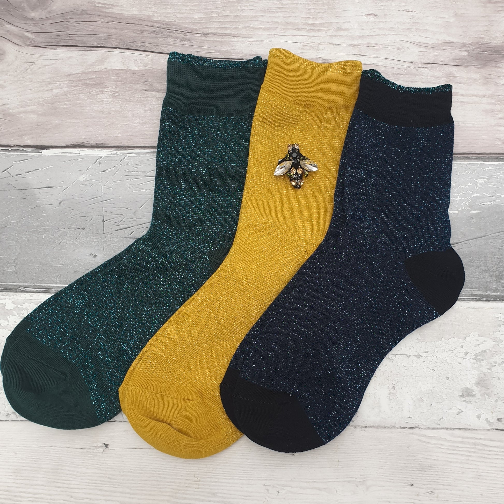 Teal, Yellow and Midnight (navy) coloured sparkly socks with a Bee Brooch made from recycled glass.
