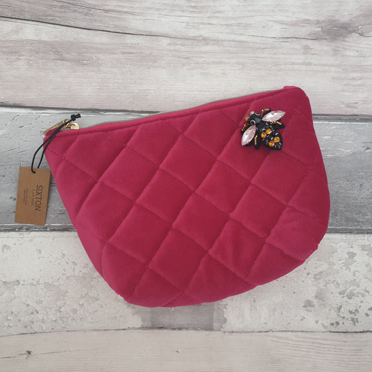 Quilted Velvet Make up Bag in vibrant Raspberry Pink, decorated with a Bee Brooch in Black and Gold.