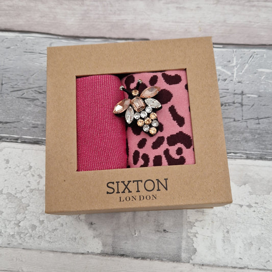 2 Pairs of pink coloured socks presented in a gift box with a sparkling Bee Brooch made of recycled glass.