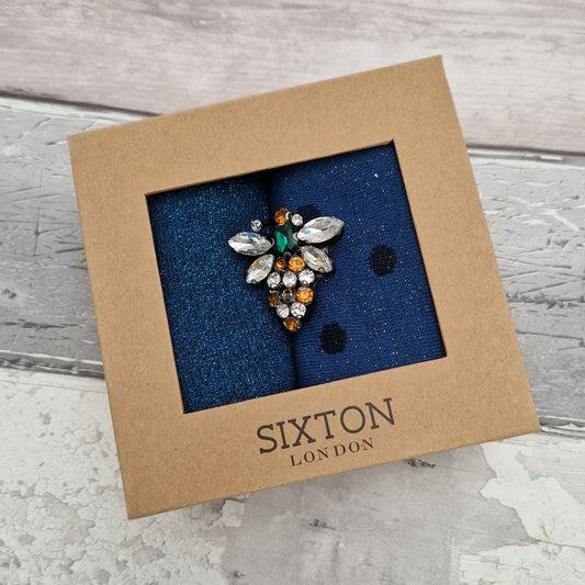 2 Pairs of blue coloured socks presented in a gift box with a sparkling Bee Brooch made of recycled glass.