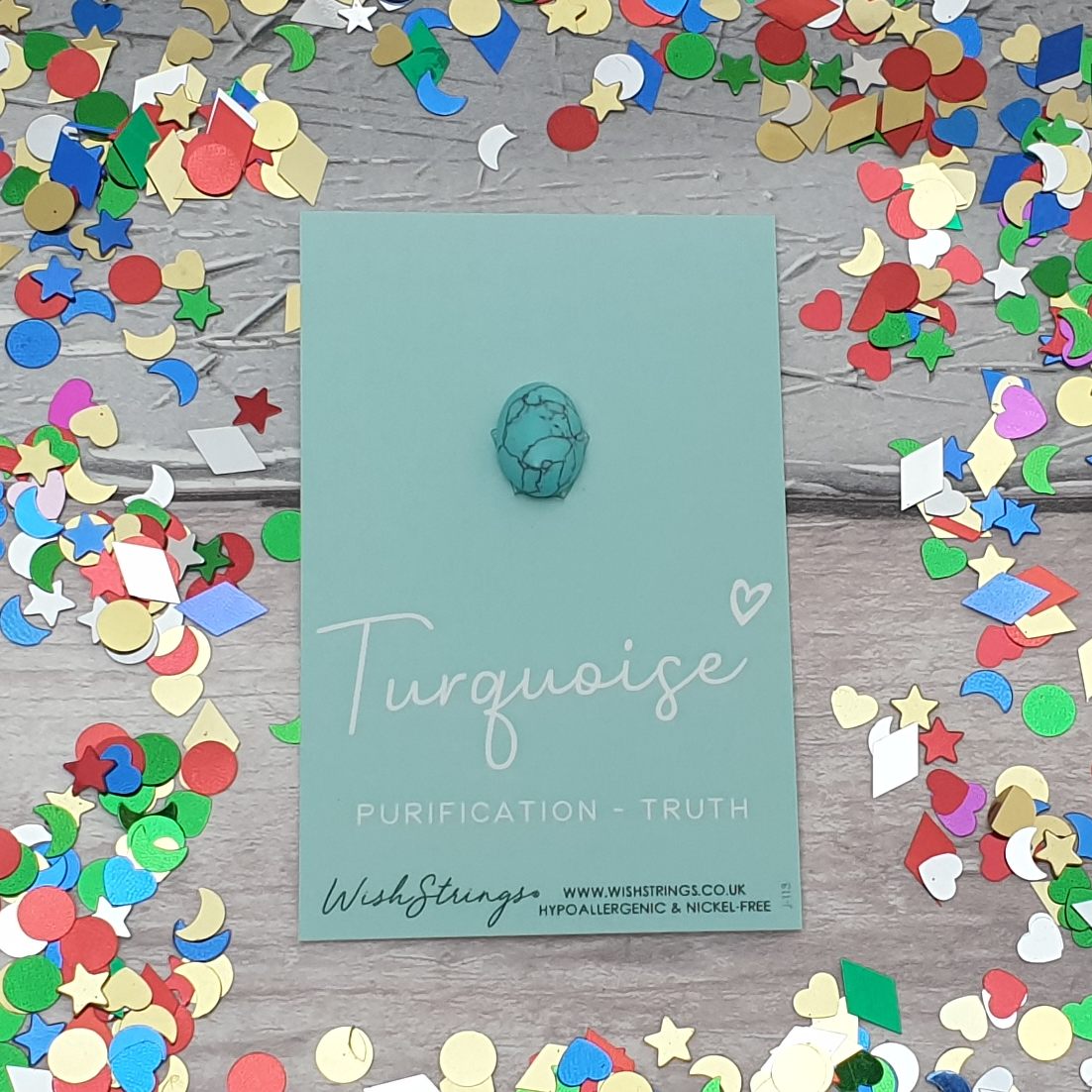 Turquoise crystal mounted on a card