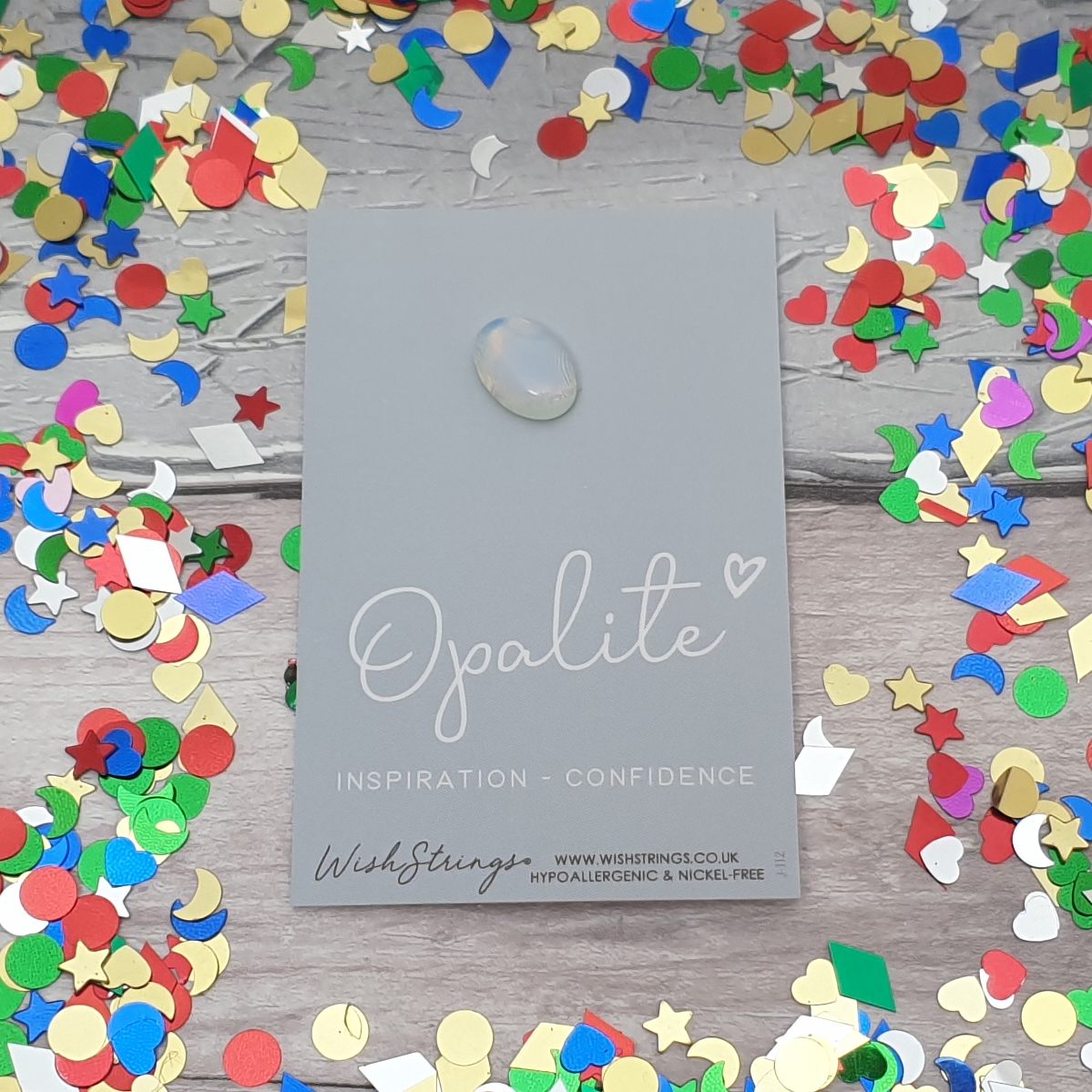 Opalite crystal mounted on a card