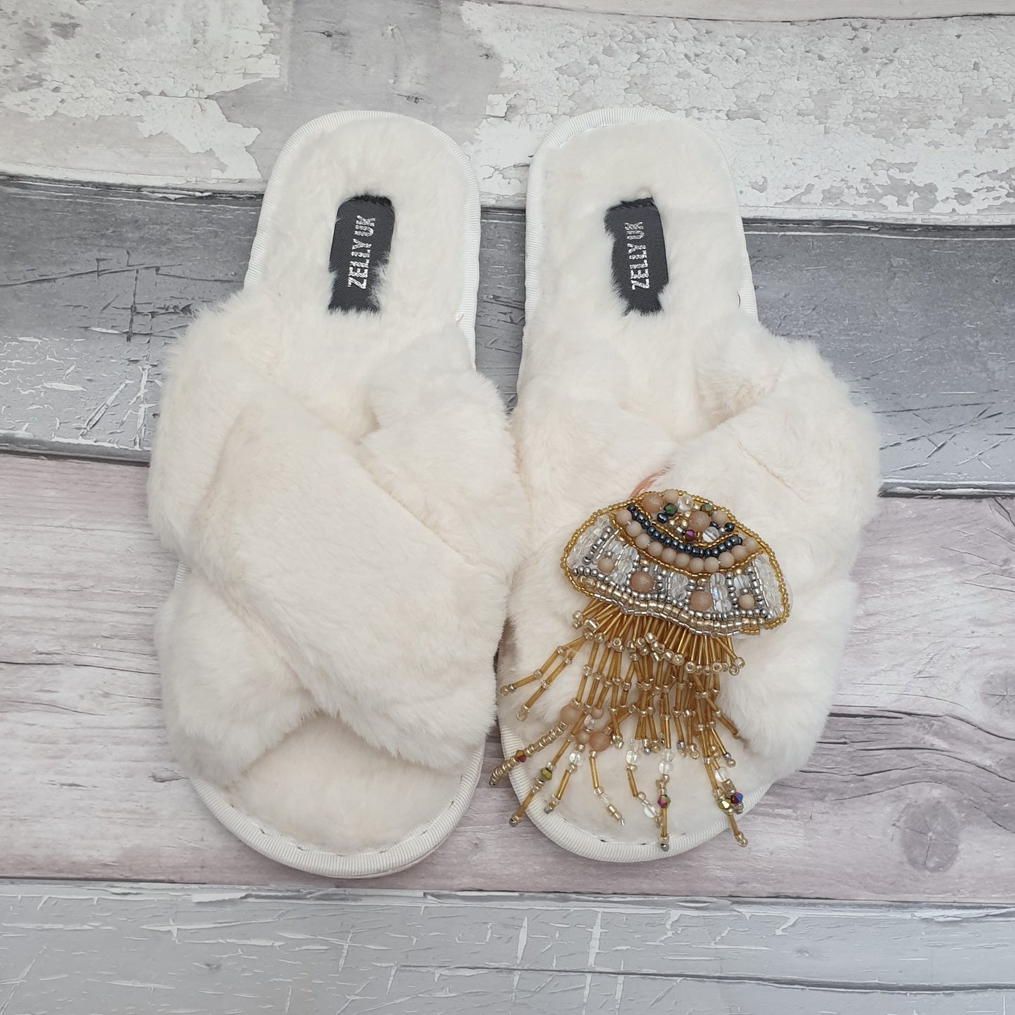 Fluffy White Slippers with a gold jellyfish brooch