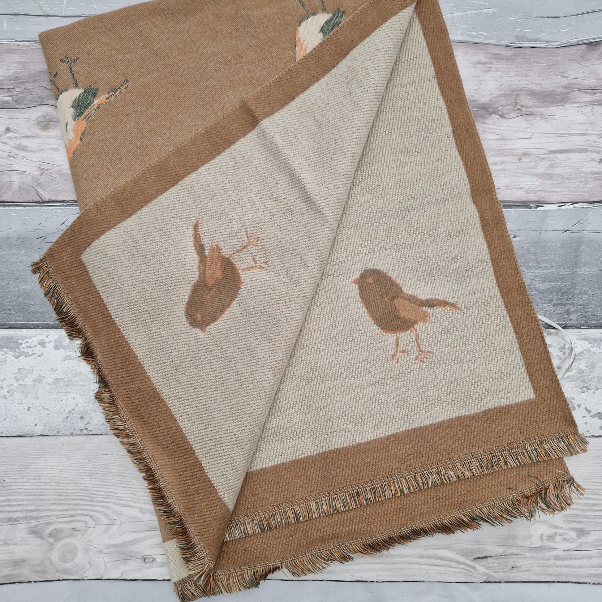 Beige coloured scarf decorated with Robins.
