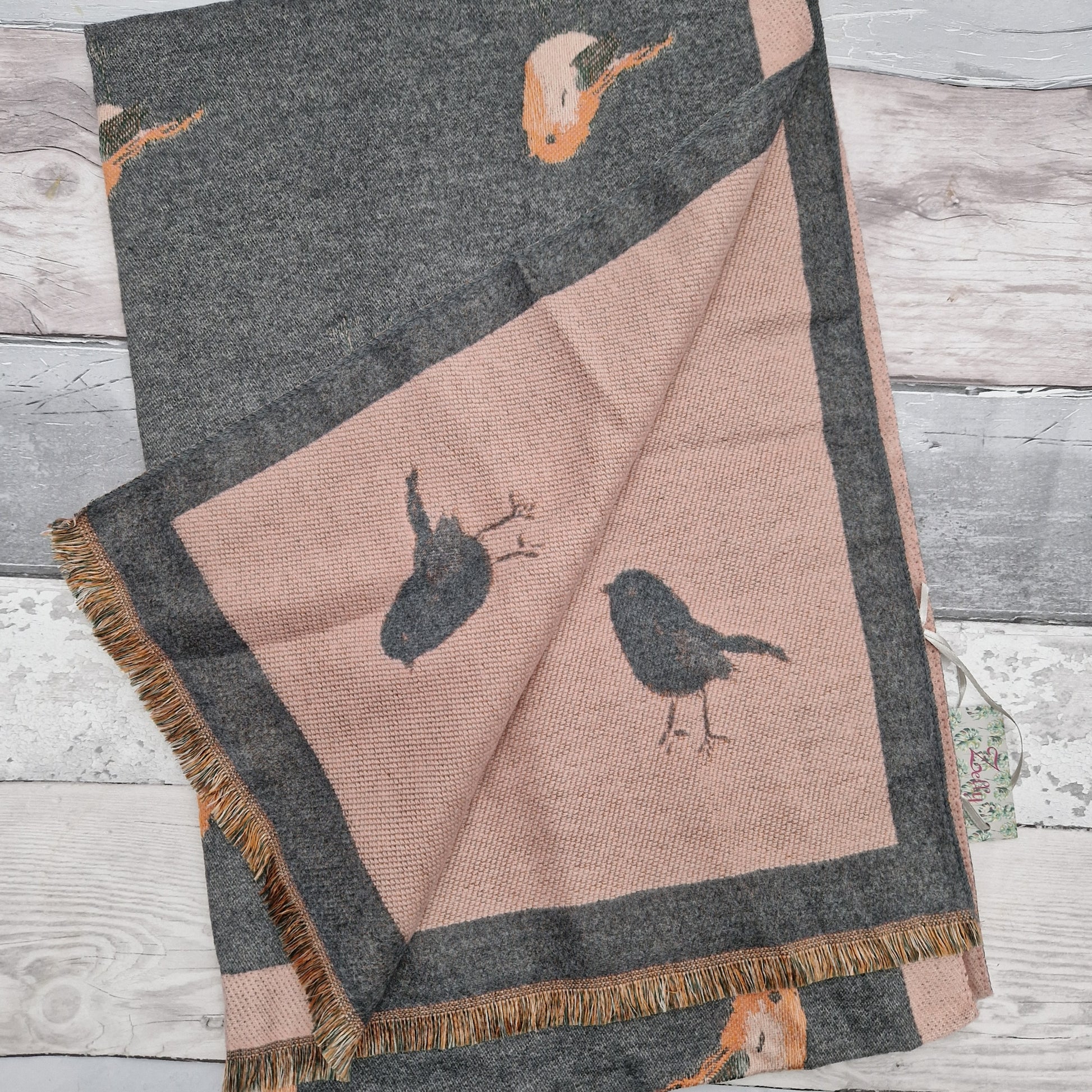 Grey and pink coloured scarf decorated with Robins.